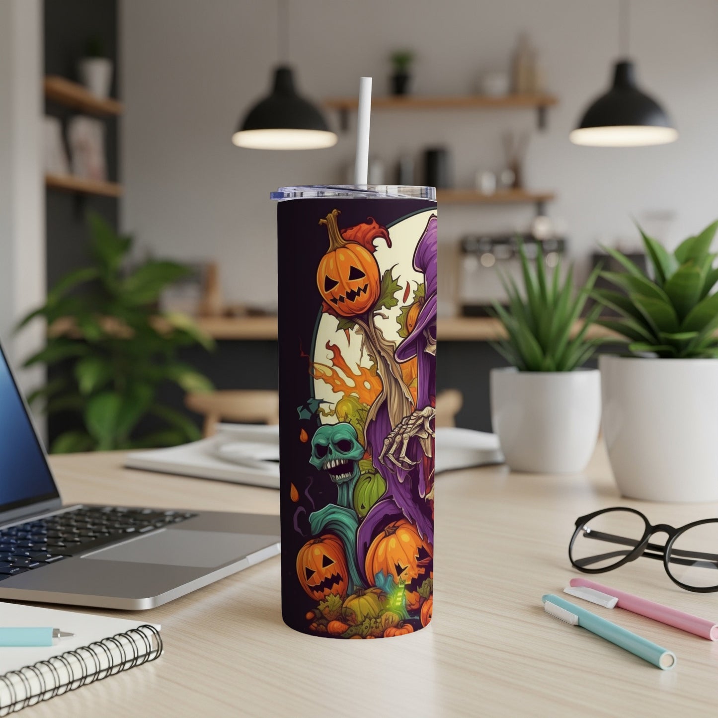 Tumbler with Halloween theme featuring pumpkins, skull, and witch.