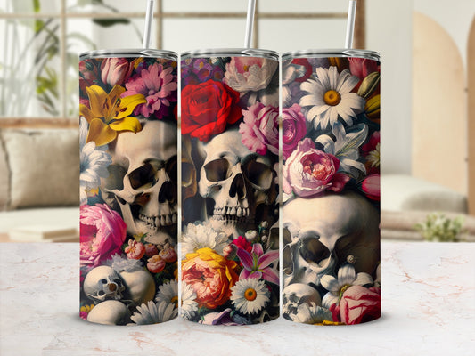 Three tumblers with skulls and floral designs in bright colors.