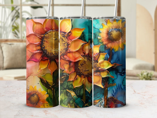 Three tumblers featuring vibrant watercolor sunflowers against a mottled background.