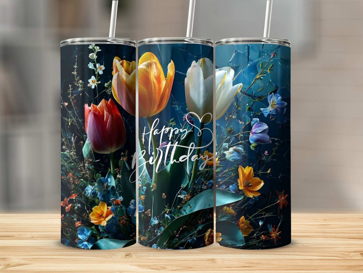 Three tumblers with colorful floral designs and "Happy Birthday" text.