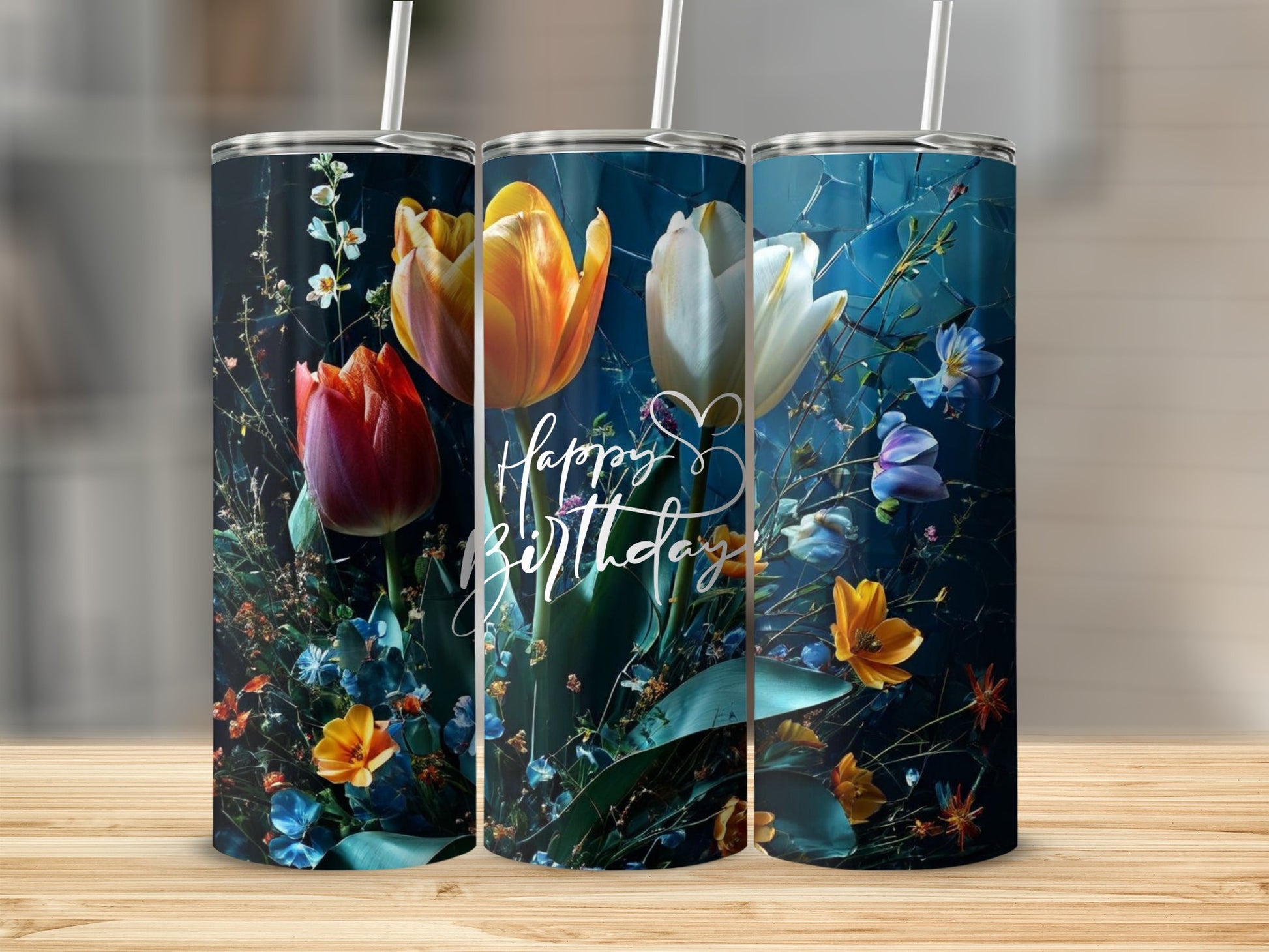 Three tumblers with colorful floral designs and "Happy Birthday" text.