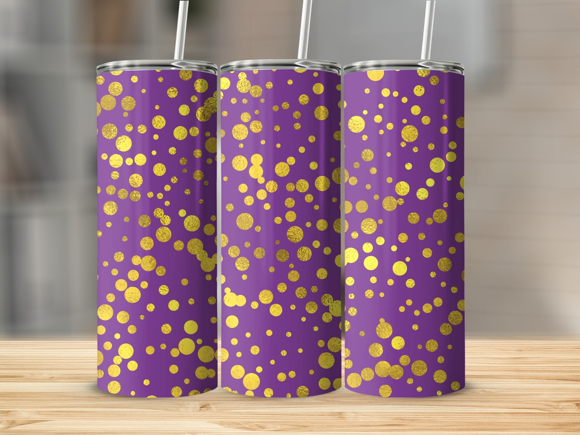Three purple tumblers with a scattered gold polka dot pattern.