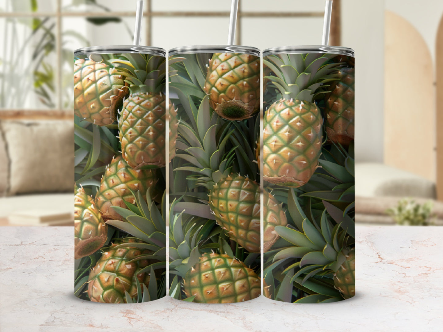 Pineapple pattern on a tall, slim tumbler with a straw.