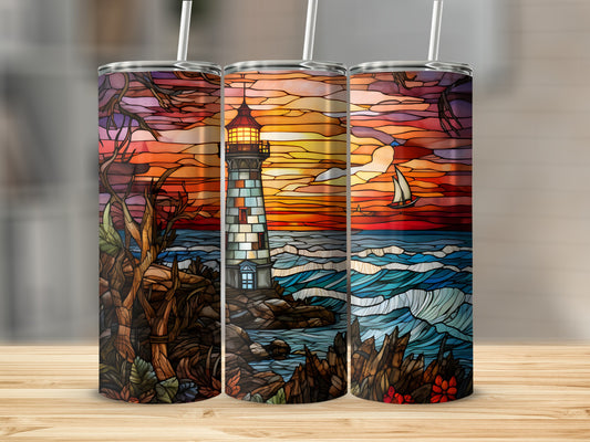 Stained glass tumbler featuring a lighthouse, sailboat, and ocean at sunset.