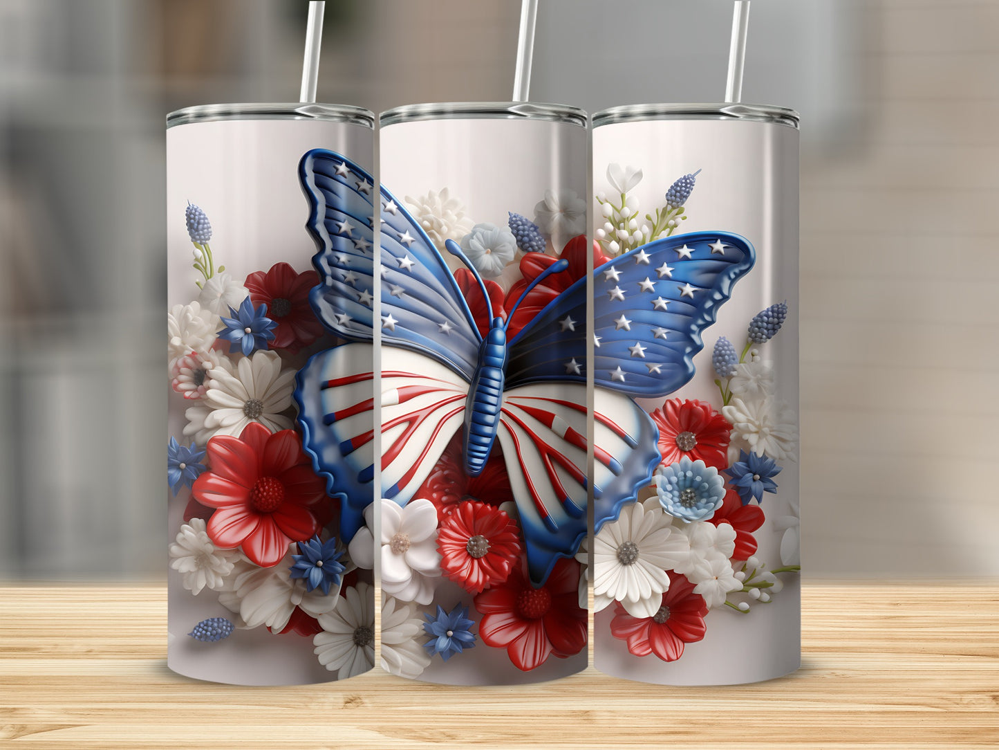 Three tumblers featuring a butterfly with American flag wings surrounded by flowers.