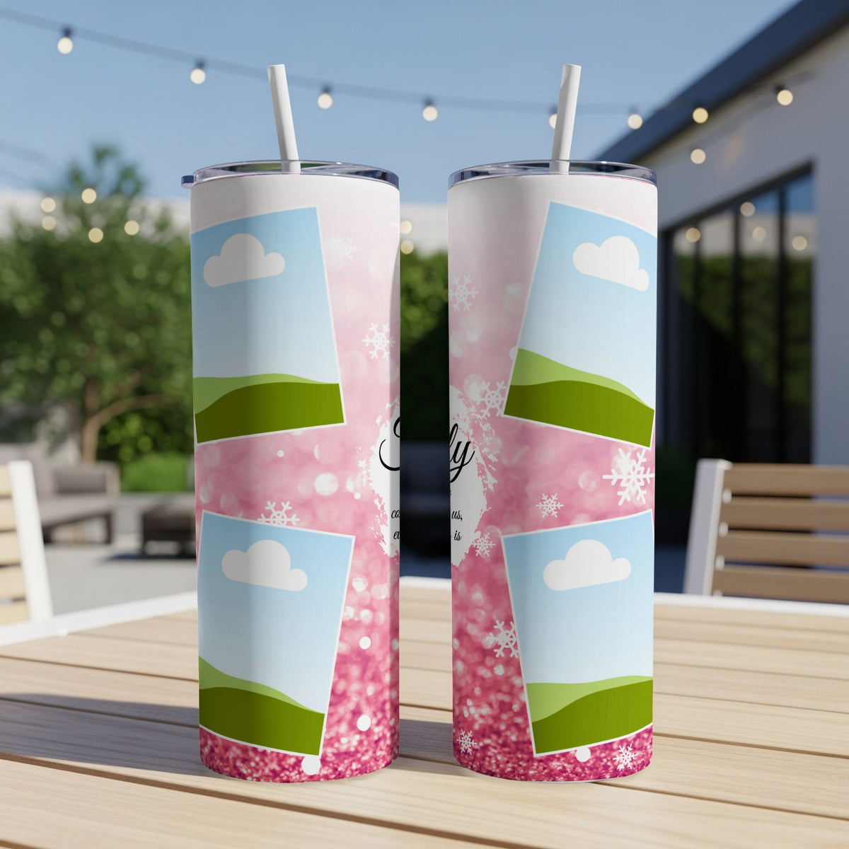 Two pink tumblers with a collage of sky, hills, and snowflakes with text.