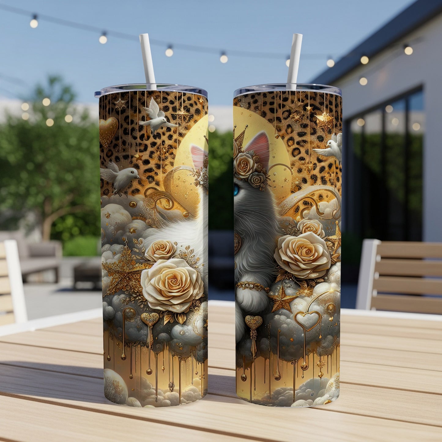 Two celestial-themed tumblers with a cat, gold roses, clouds, and leopard print.
