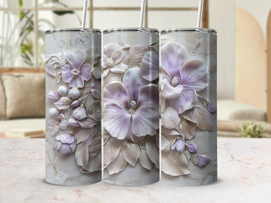 Three tumblers with embossed pastel floral designs and marble texture.