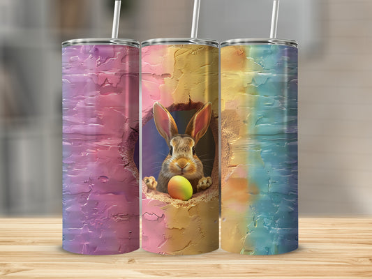 Three Easter bunny tumblers with colorful, textured designs.