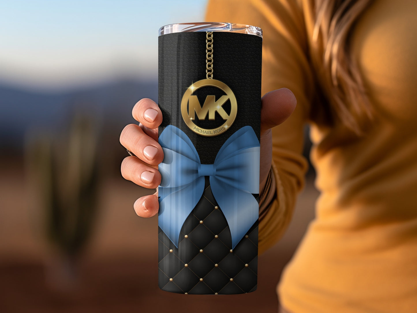 Black Tumbler with Blue Bow and Gold MK Chain Design