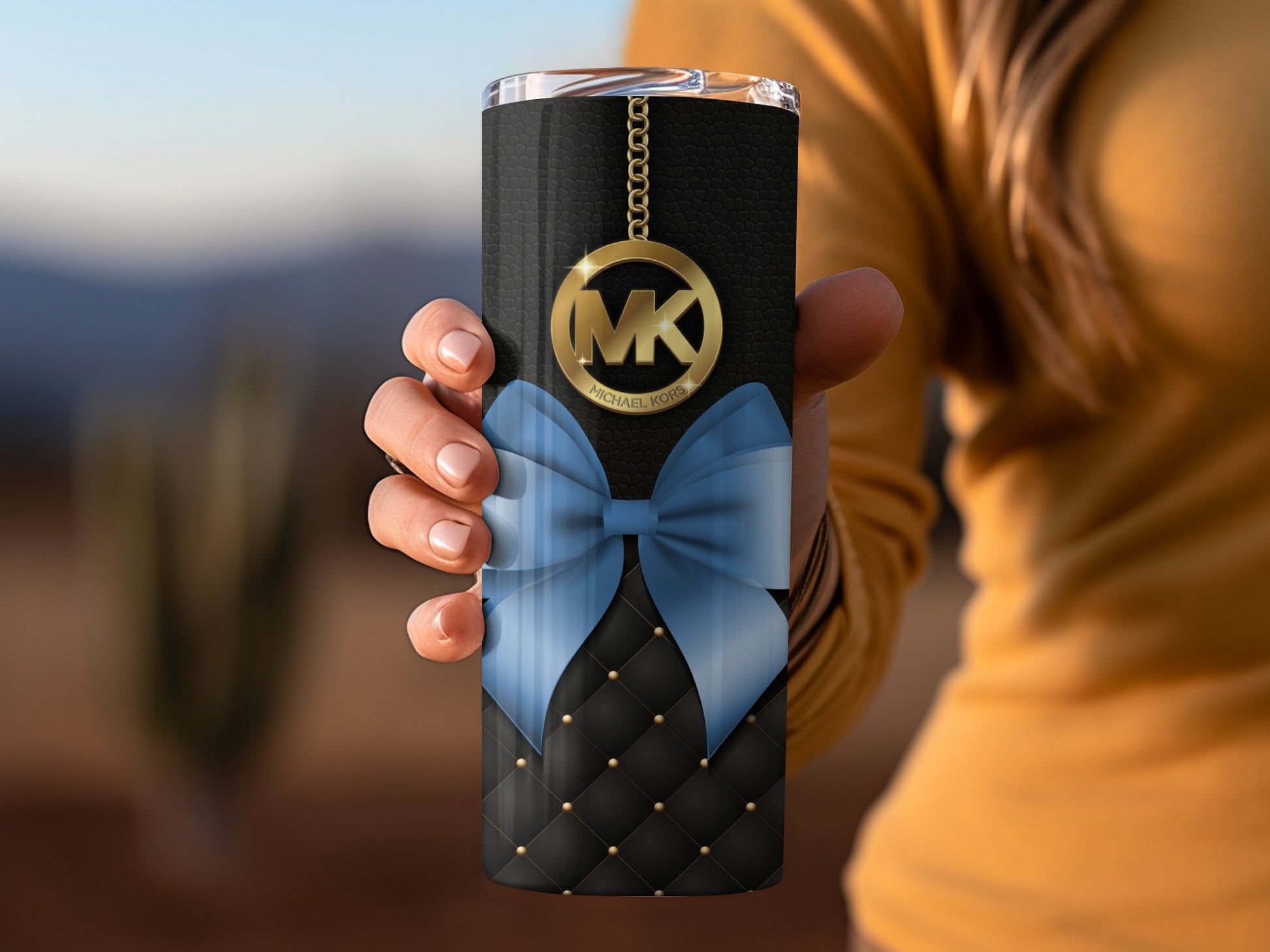 Black Tumbler with Blue Bow and Gold MK Chain Design