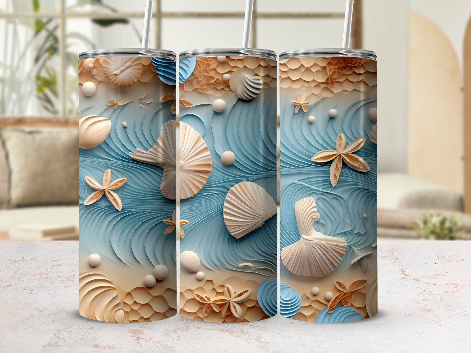 Three tumblers with a seashell and ocean wave design.