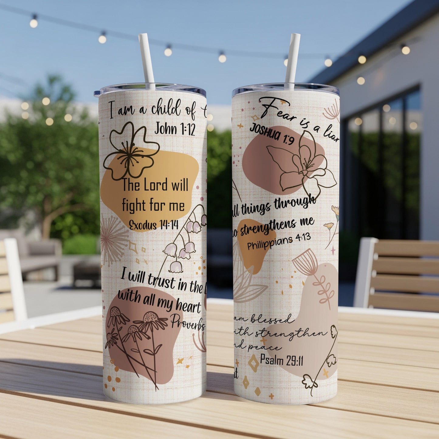 Two tumblers with floral designs and religious scripture.