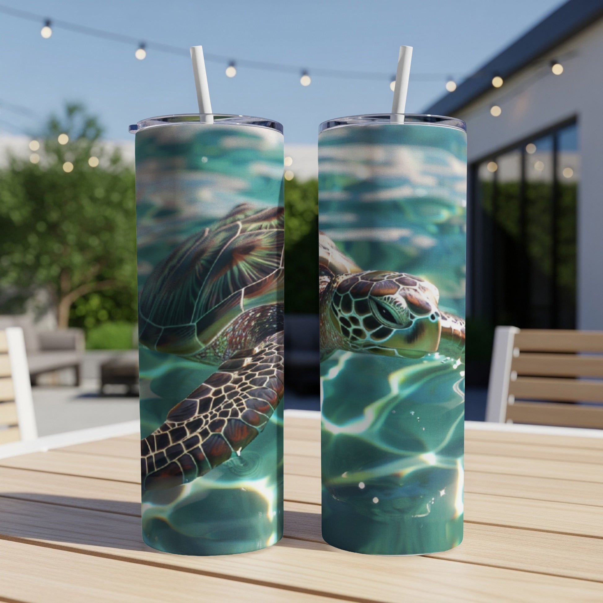 Sea turtle swimming in clear blue water, shown on two tumblers.