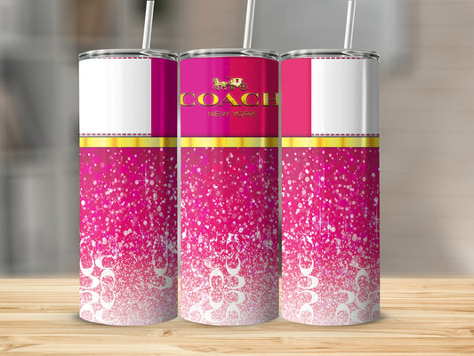 Pink speckled tumblers with Coach New York logo and horse carriage emblem.