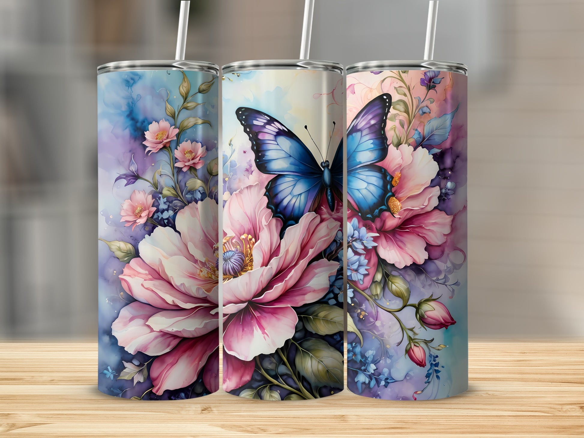 Three tumblers featuring pink peonies and a blue butterfly design.