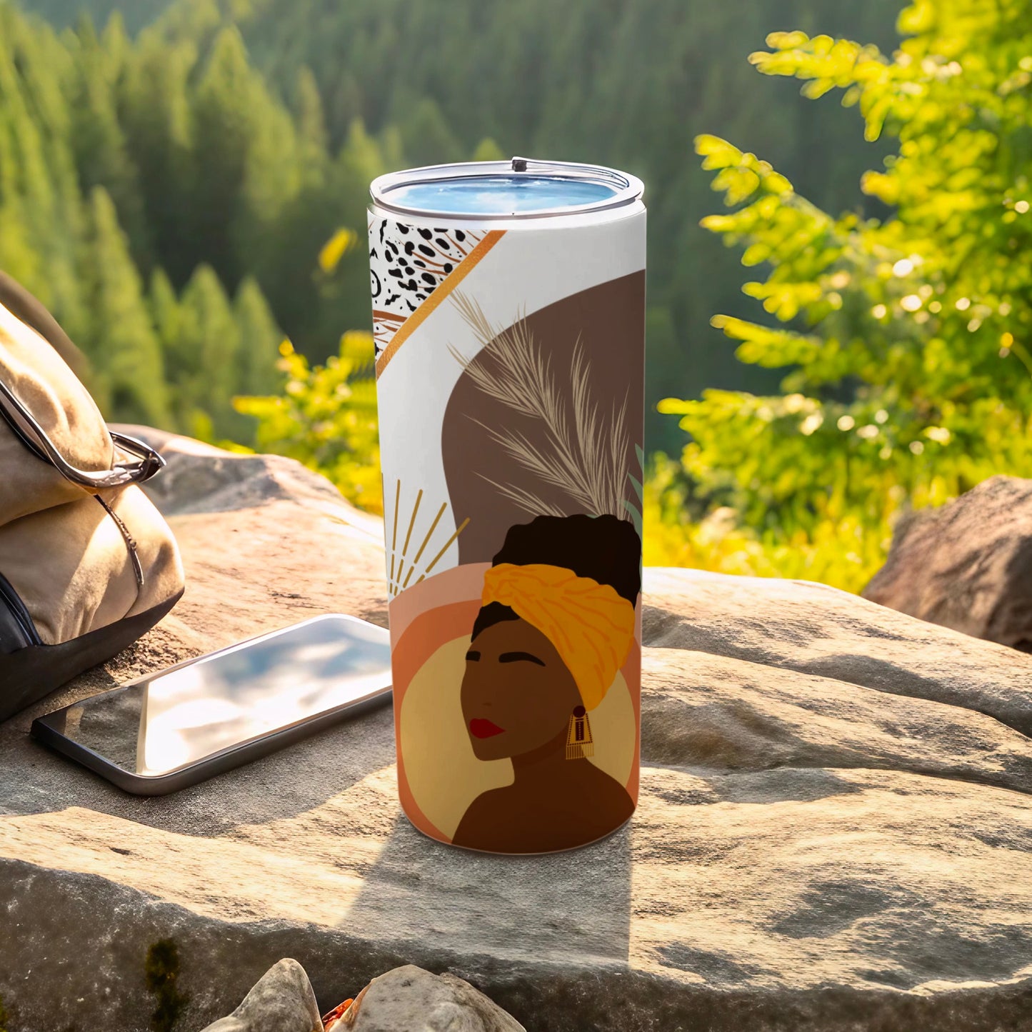 Tumbler with abstract portrait of a Black woman in a yellow headwrap.
