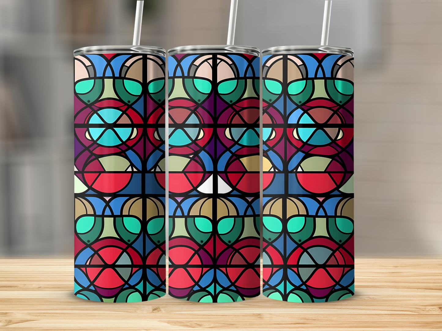 Three tumblers with a geometric stained-glass pattern.