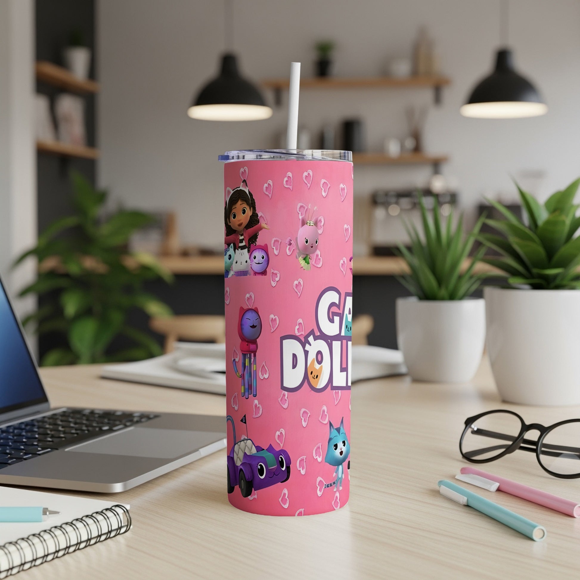 Pink tumbler with Gabby's Dollhouse characters and purple car.