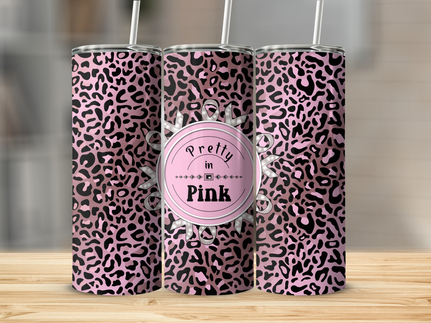 Pink leopard print tumbler with "Pretty in Pink" text.