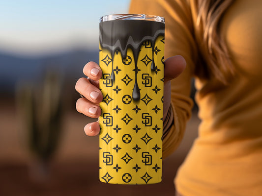 Brown Drips Above Patterns On Gold Background Tumblers