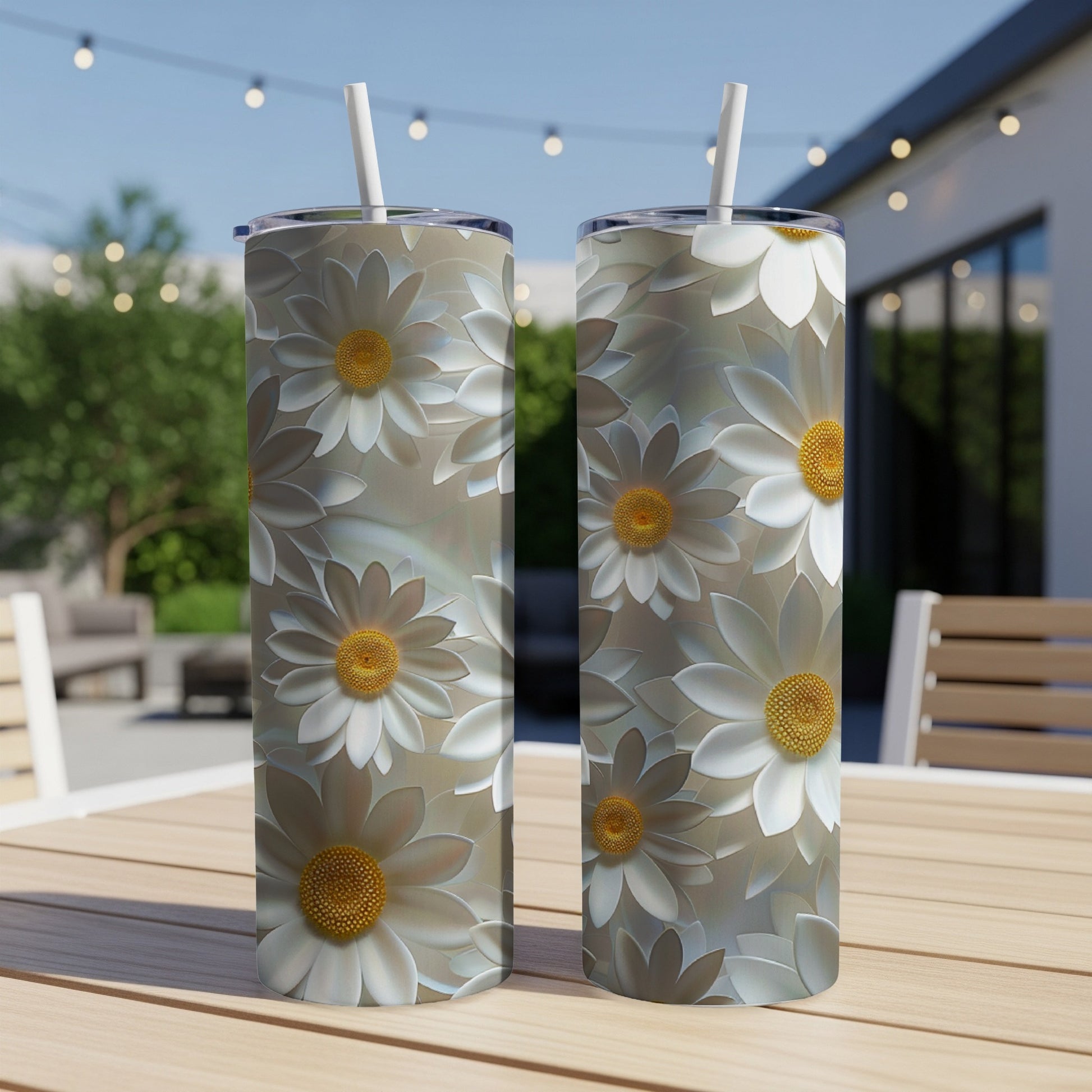 Two tall tumblers with a repeating pattern of white daisies.