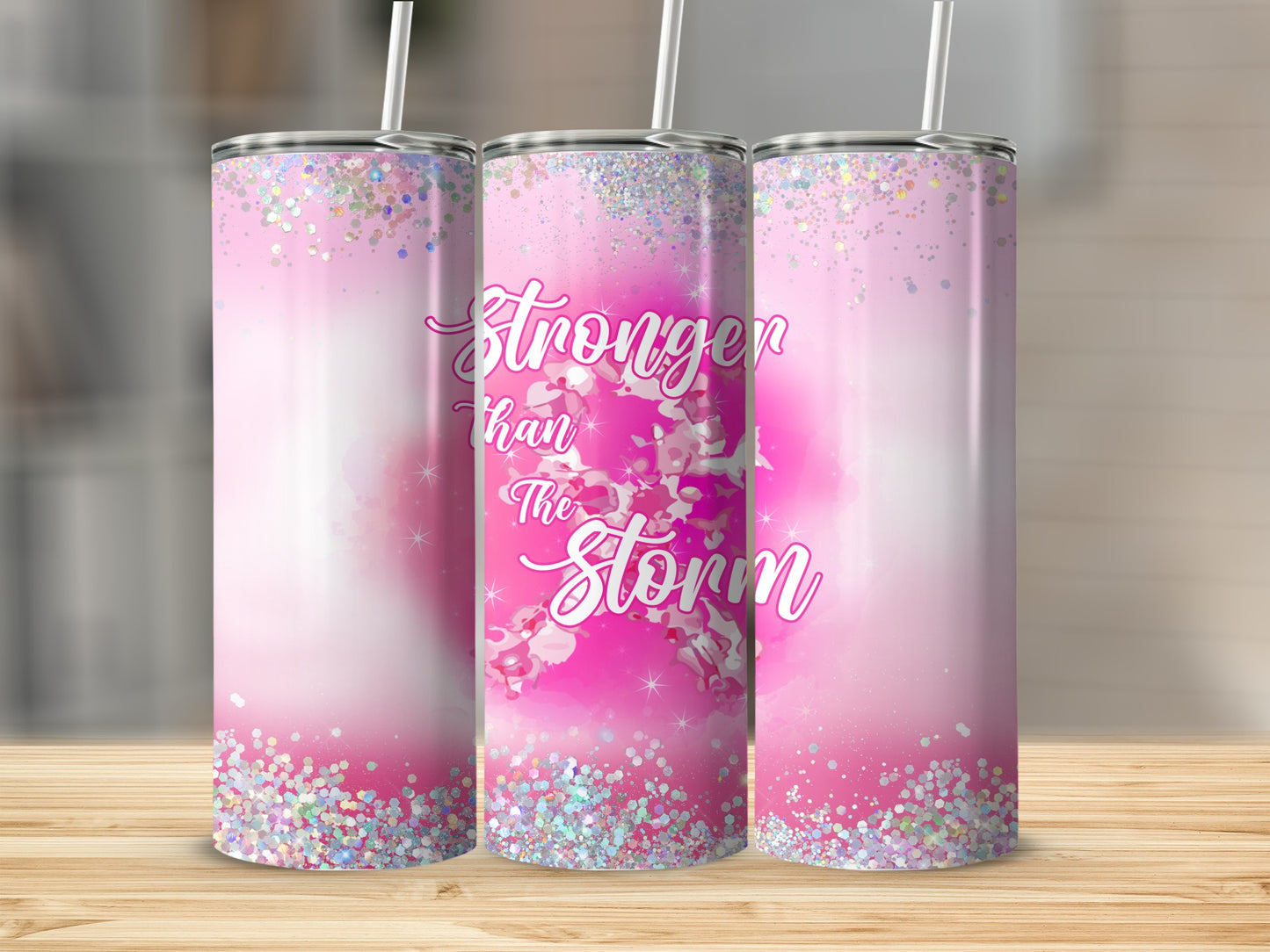 Pink glitter tumbler with "Stronger than the Storm" text.