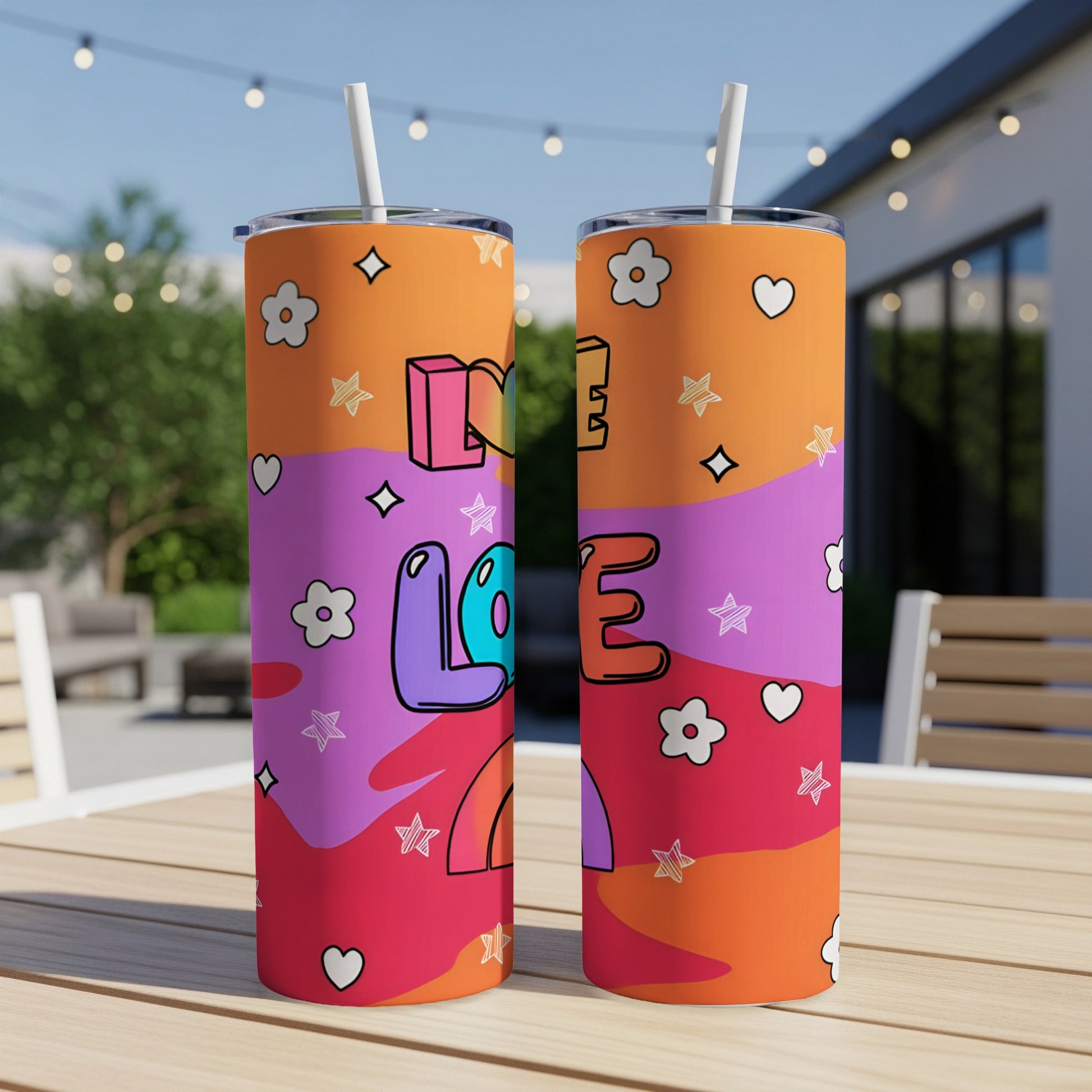 Two tumblers with "LOVE" text and colorful rainbow and star patterns.