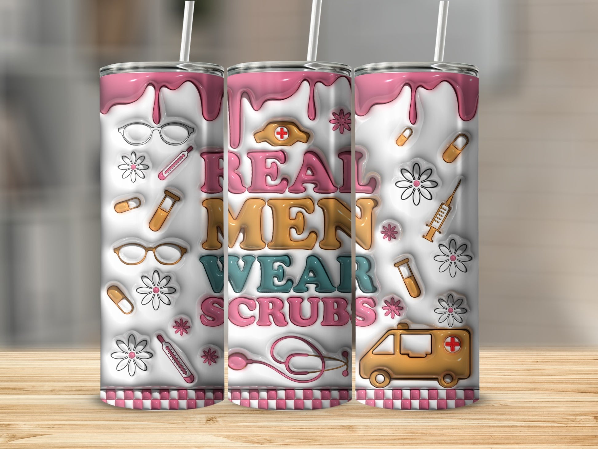 "Real men wear scrubs" text on a pink and white patterned tumbler with medical icons.
