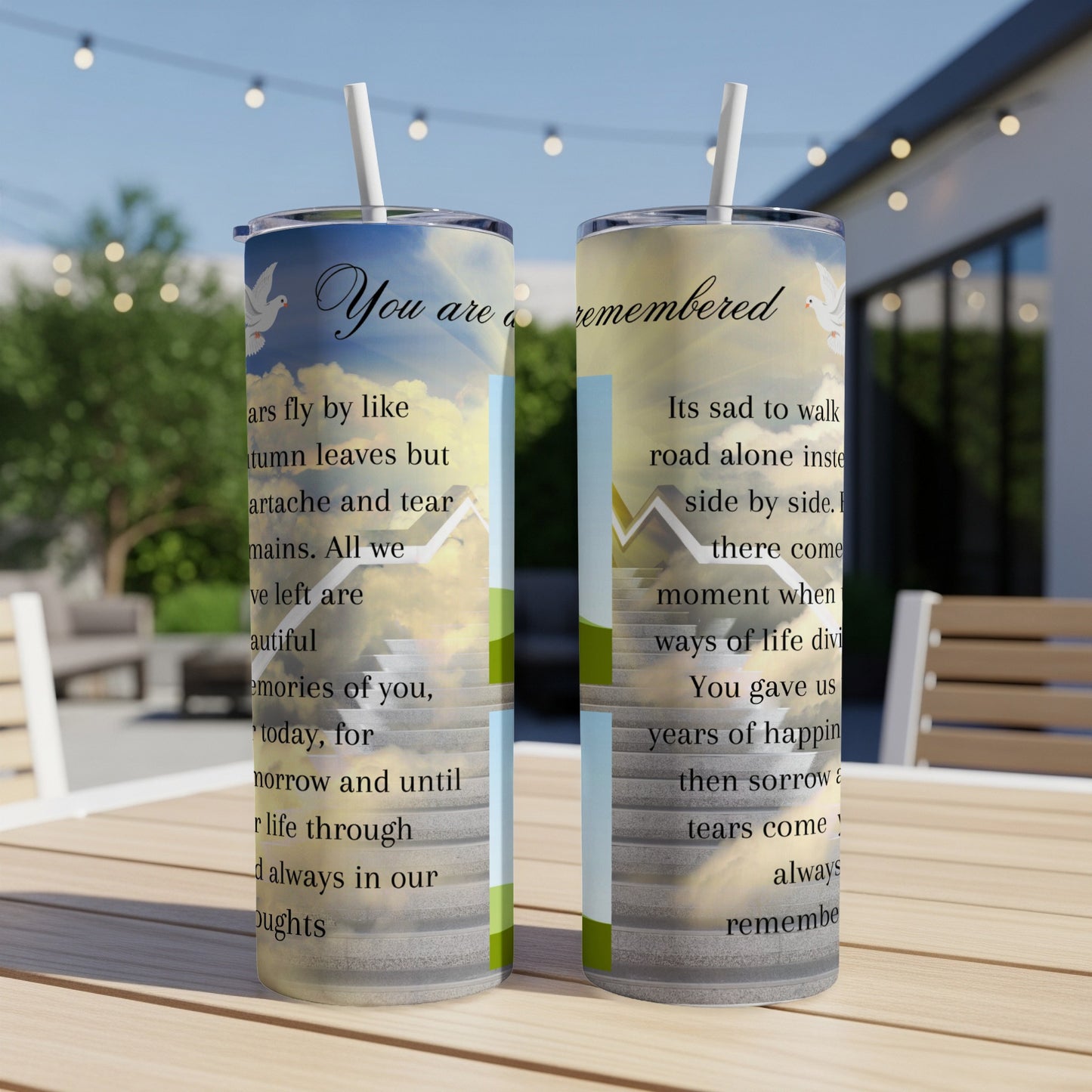 Two tumblers with sky clouds and doves, featuring memorial poetry.