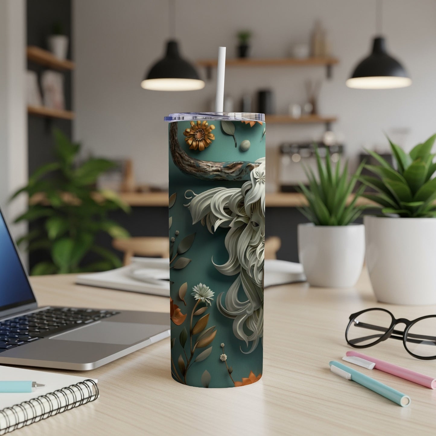 Teal tumbler with a detailed lion's head and floral design.