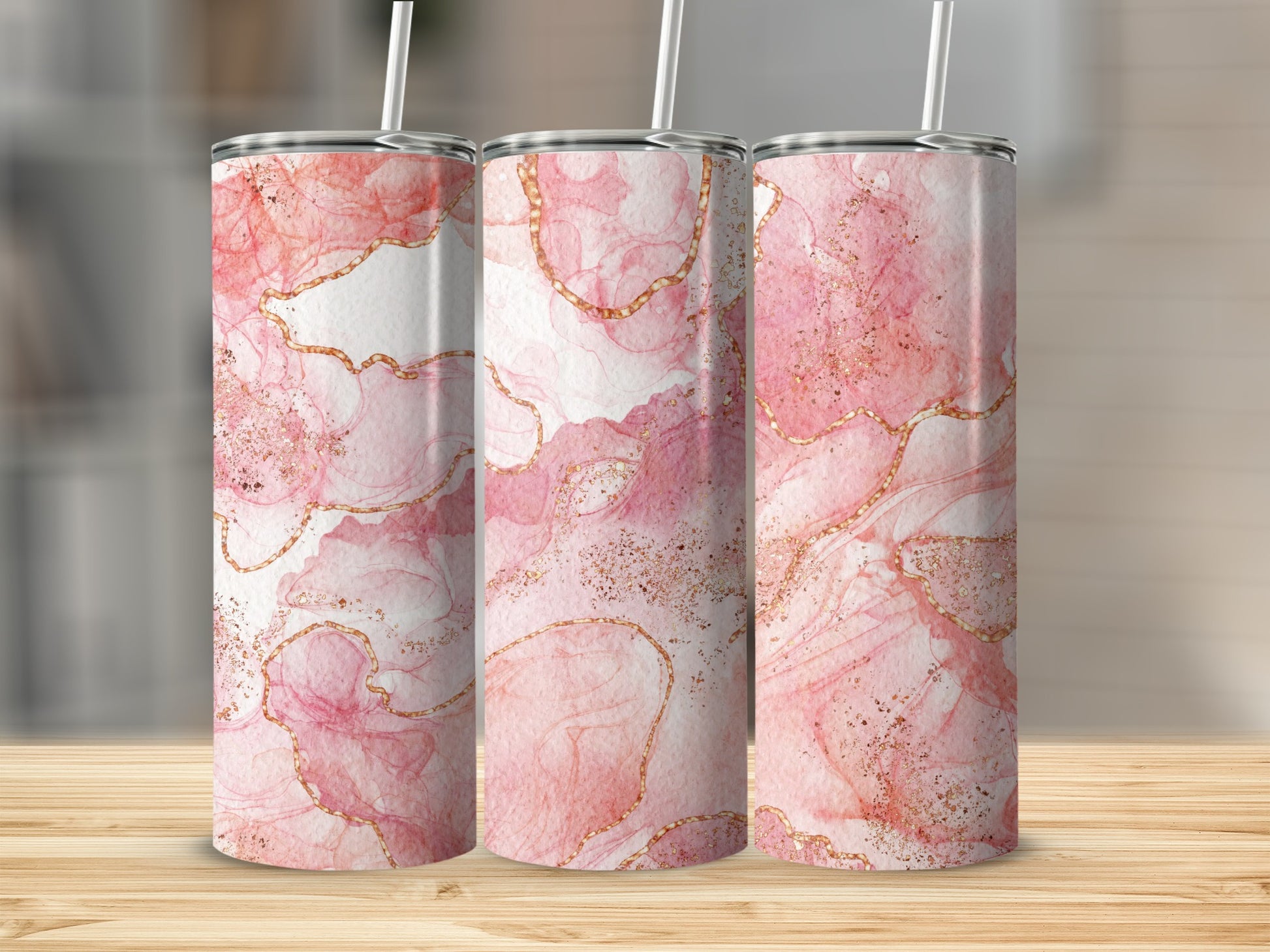 Three tumblers with pink and gold abstract marble design.