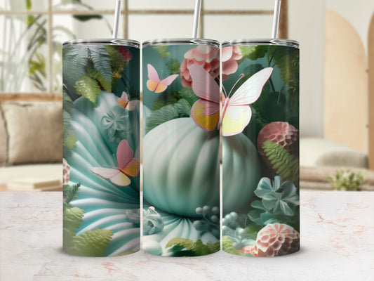 Mint green pumpkin, butterflies, and floral accents on a tumbler.
