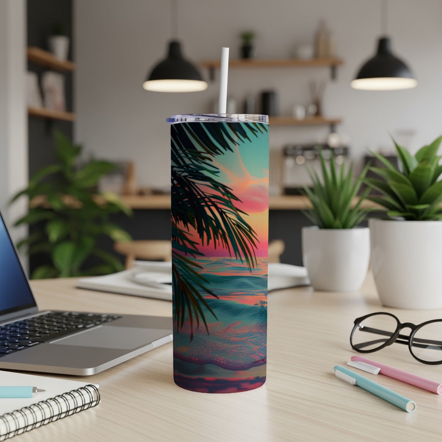 Tropical sunset on a beach with palm fronds, on a tumbler.