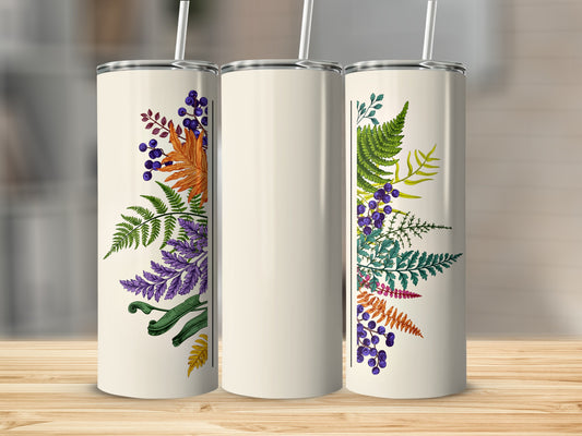 Cream tumbler with floral and leaf design and straw.