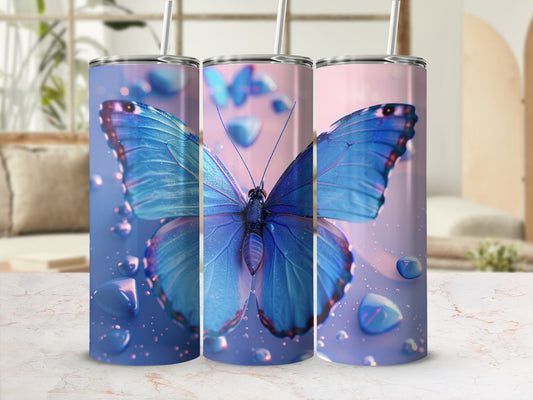 Blue butterfly on three tumblers with water droplets.