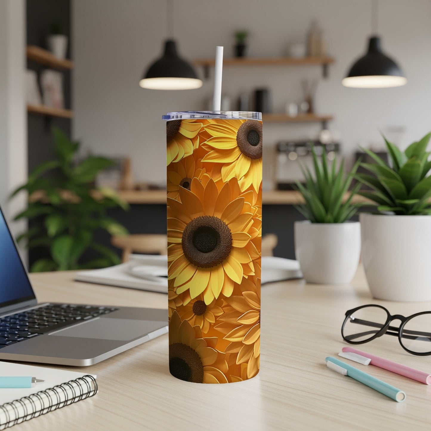 Tall tumbler with a repeating sunflower pattern, lid, and straw.