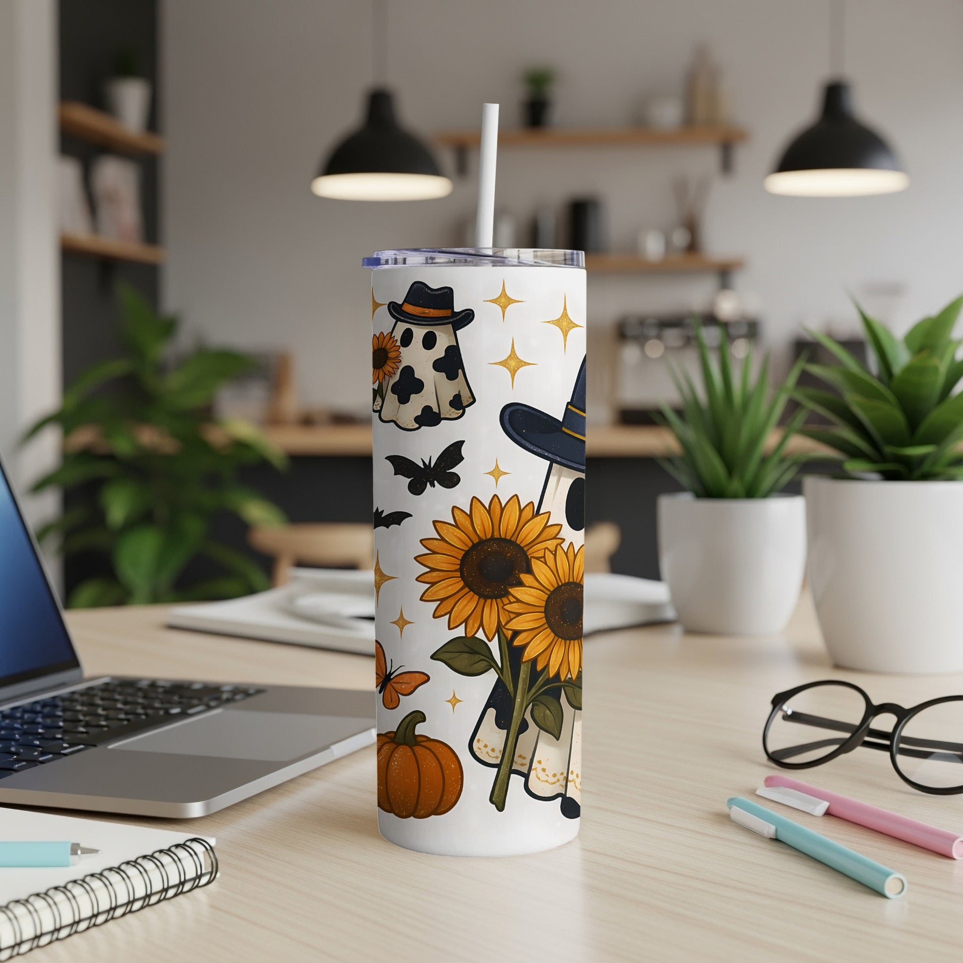 White tumbler with Halloween ghosts, sunflowers, pumpkin, bats, and stars design.