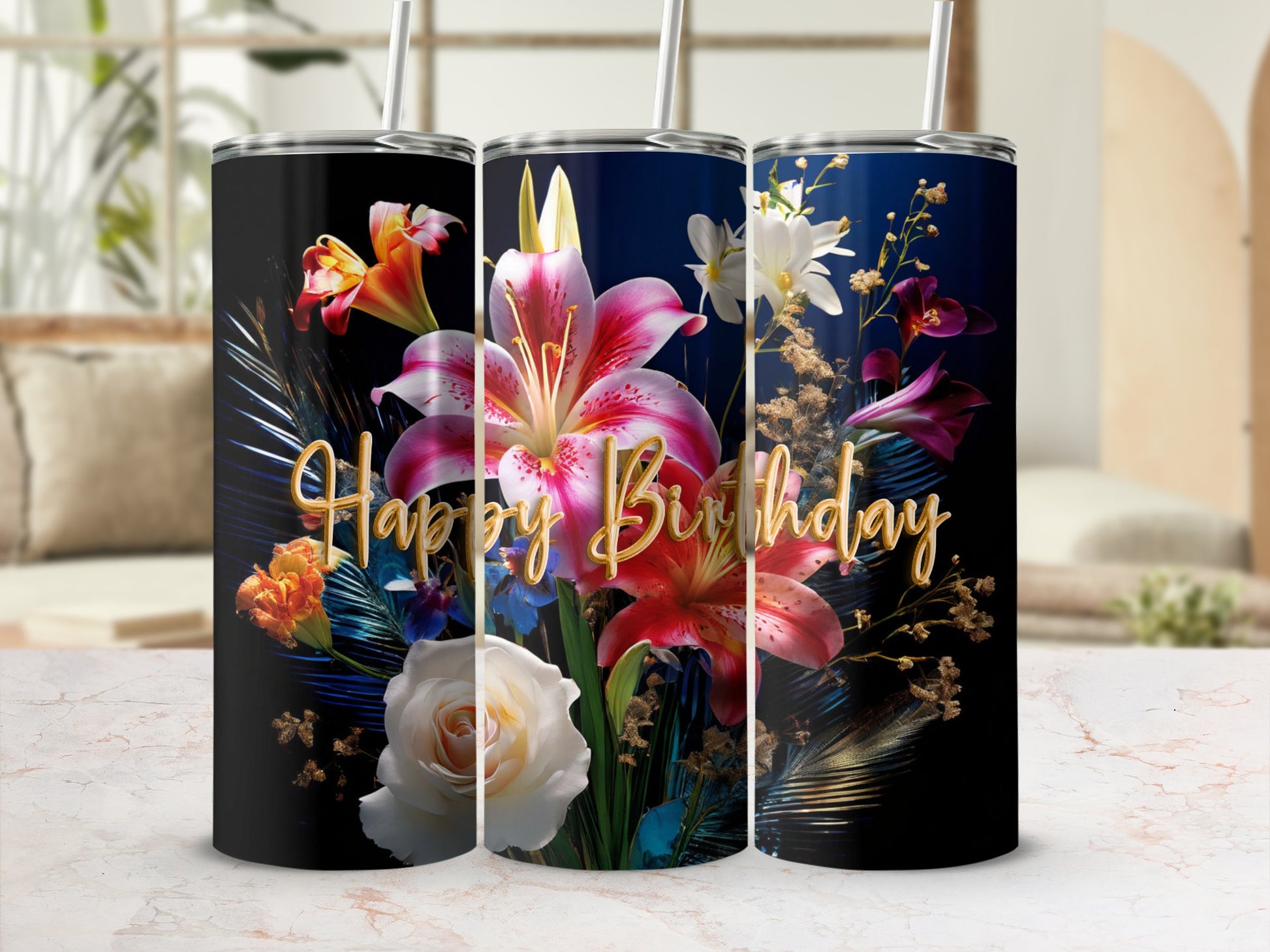 Floral "Happy Birthday" design on three black tumblers with straws.