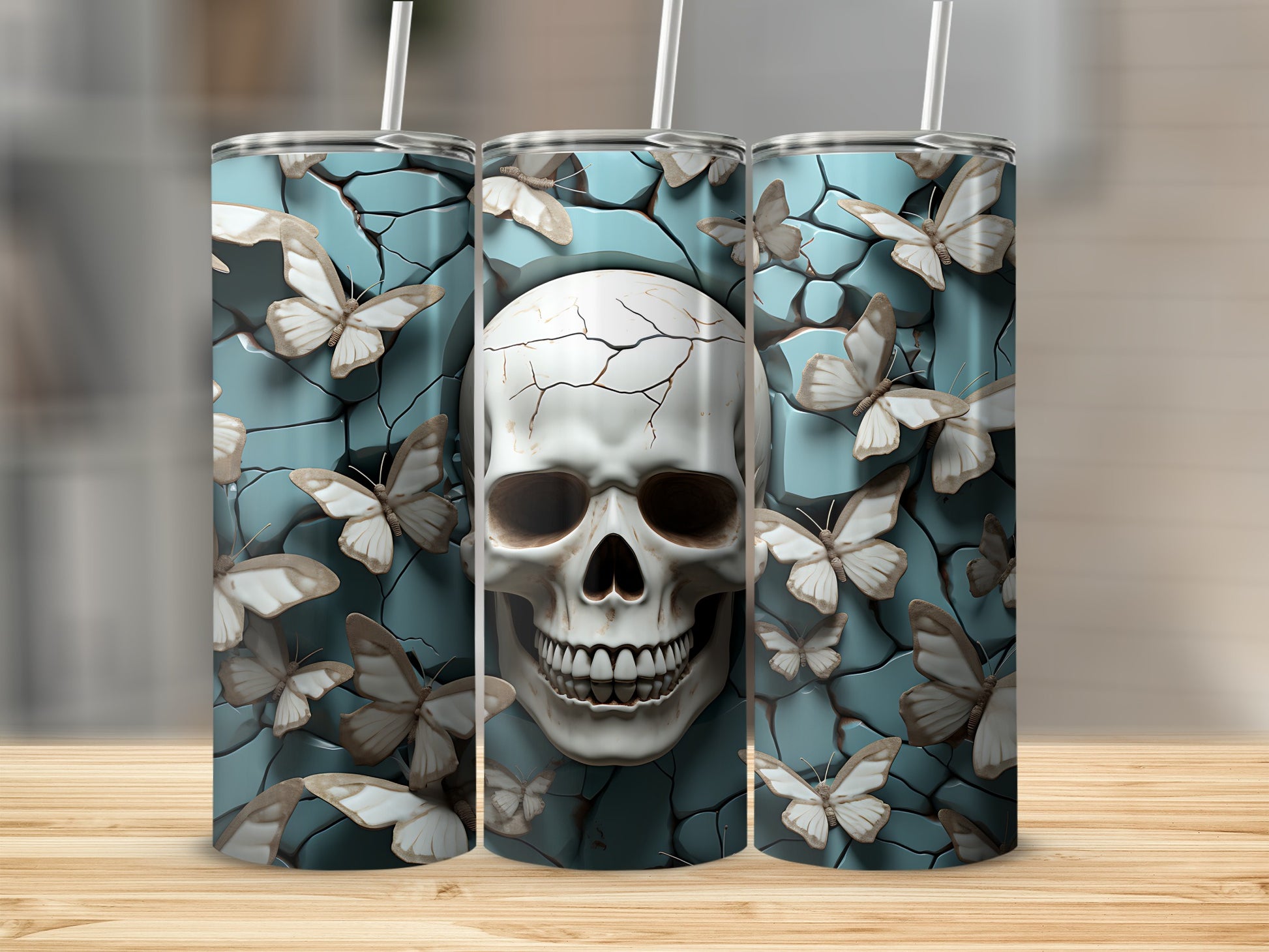 Three tumblers with a cracked skull and butterflies design.