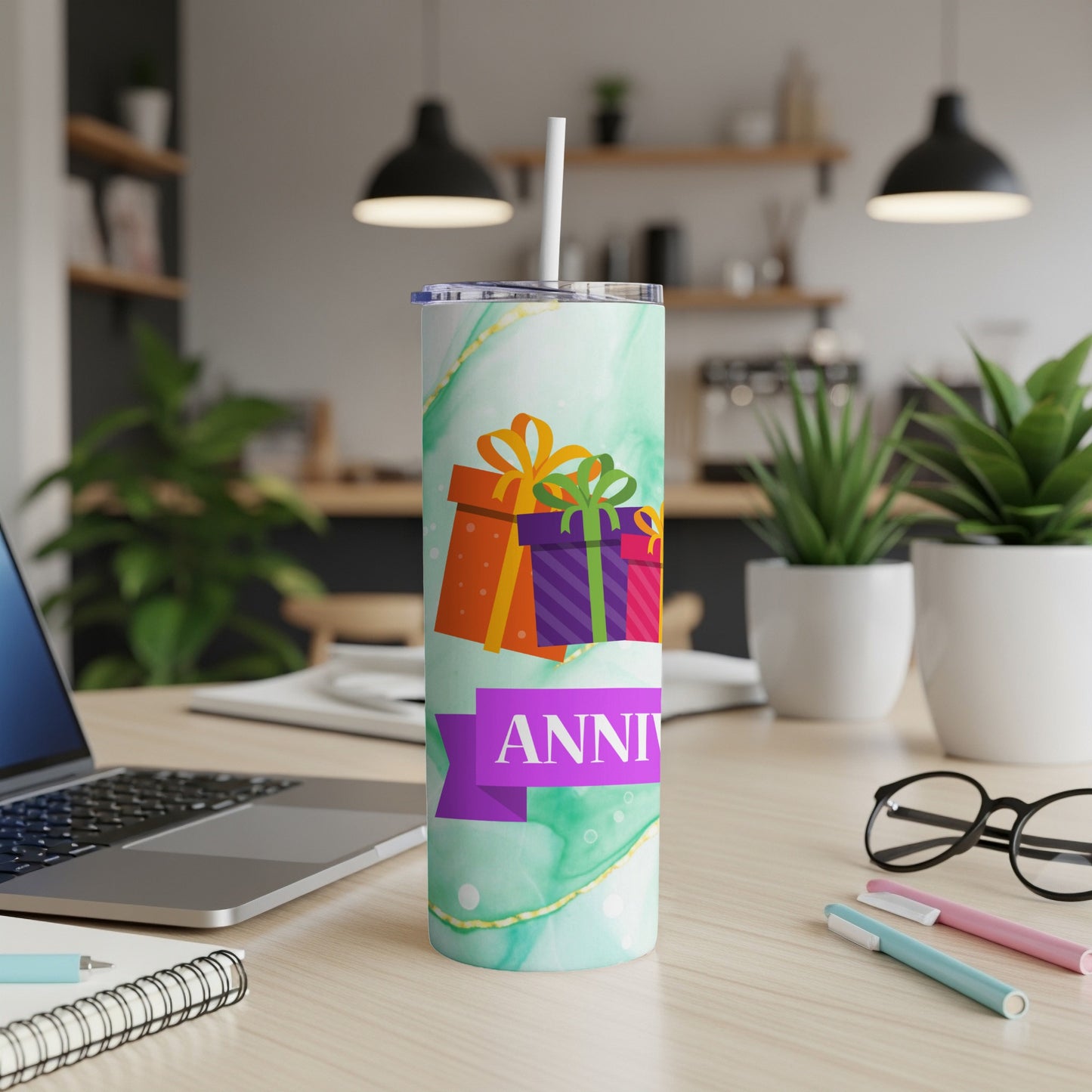 Green marble tumbler with colorful gift boxes and "ANNIVERSARY" text.