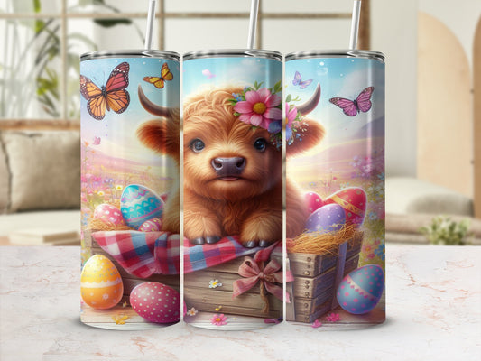 Highland calf in Easter basket with colorful eggs and butterflies.