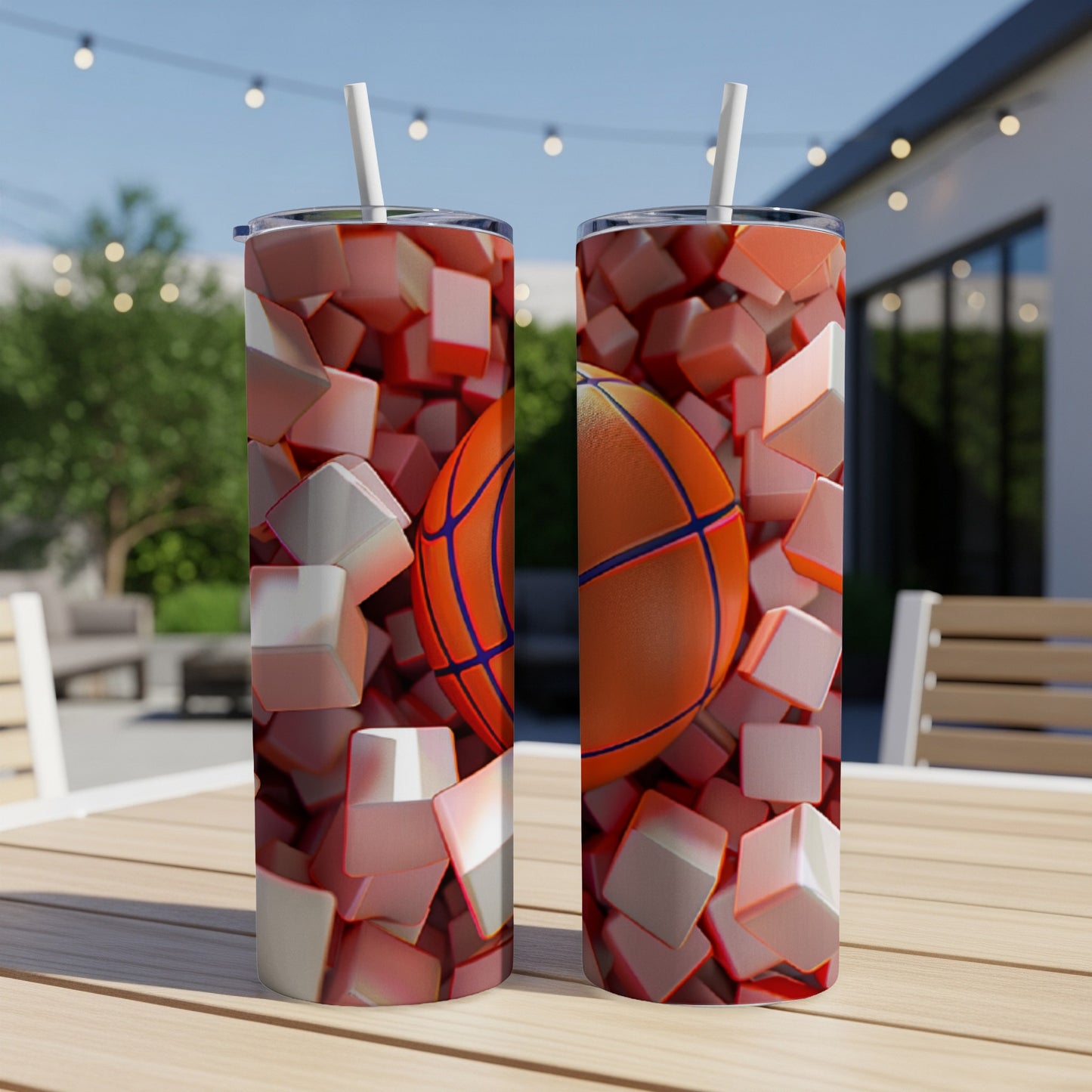 Two skinny tumblers with basketball and cubes design, with a straw.