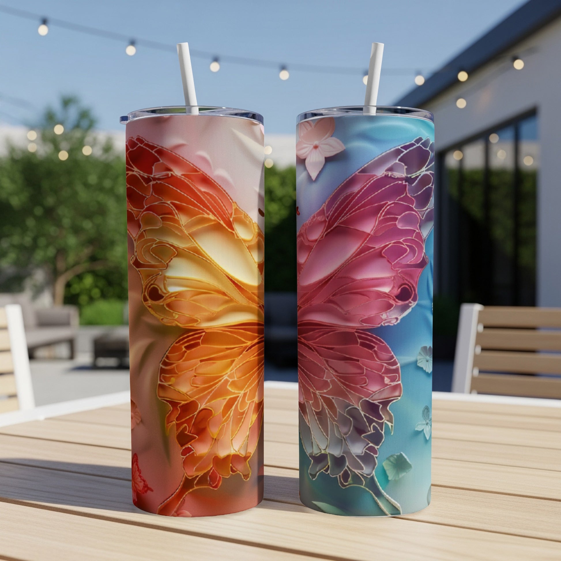 Two tumblers with butterfly wing designs, one orange, one blue.