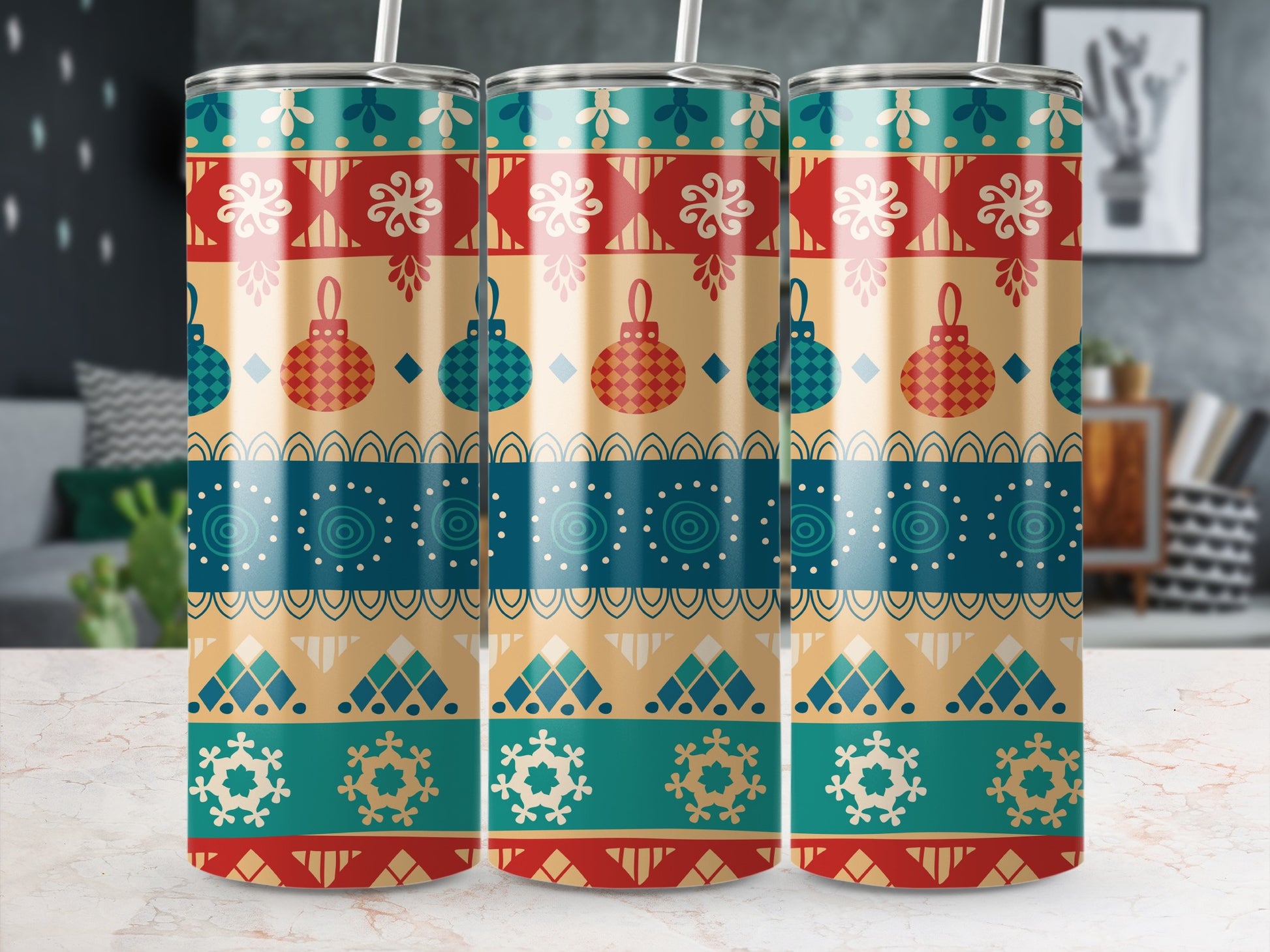 Three tumblers with a repeating colorful geometric holiday pattern.