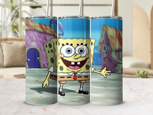 SpongeBob SquarePants character on a tumbler with coral and Bikini Bottom houses.