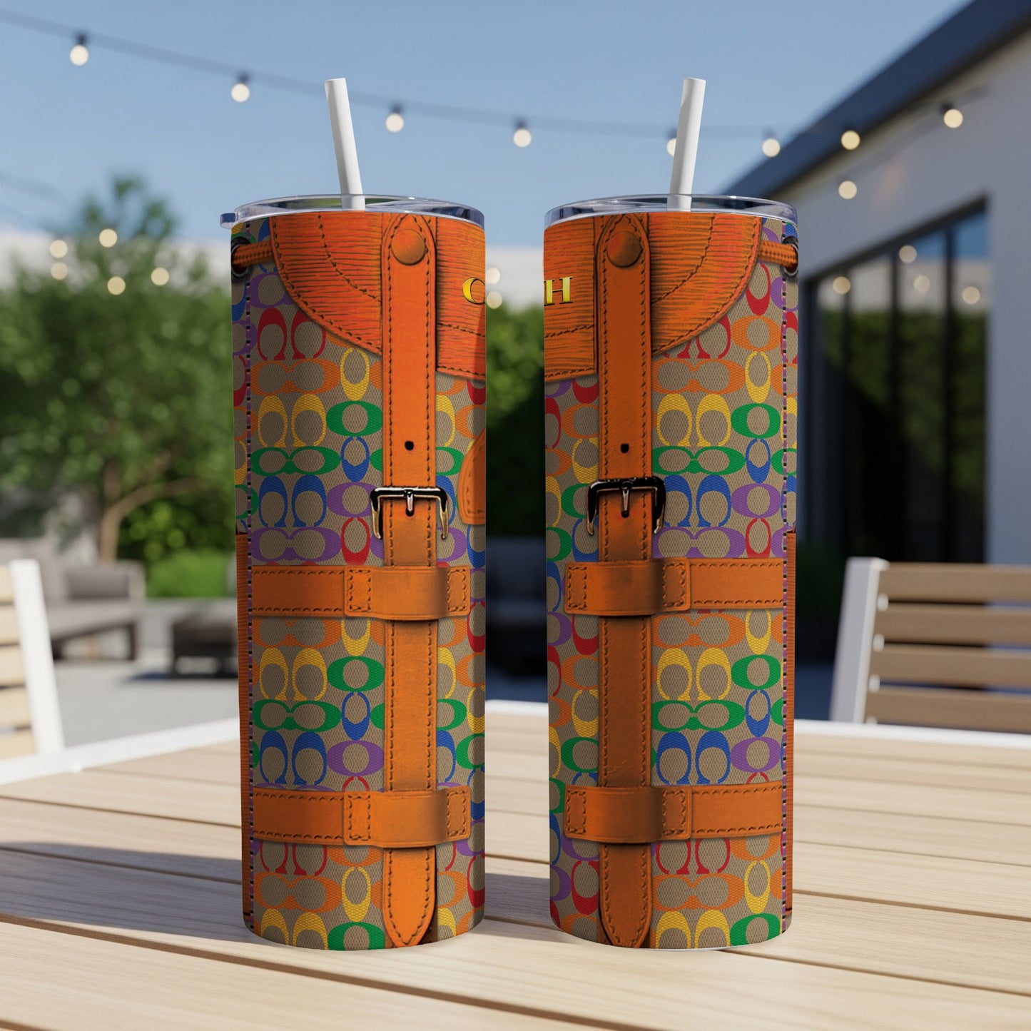 Two tumblers with rainbow patterned logo print and brown leather straps.