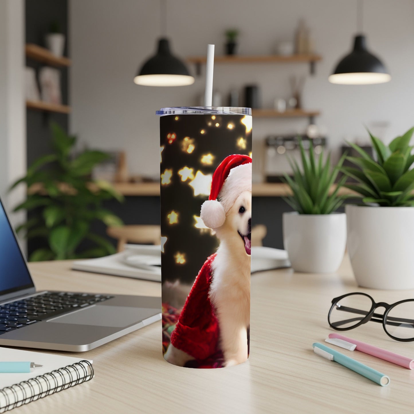 Golden retriever wearing Santa hat on a festive patterned tumbler.