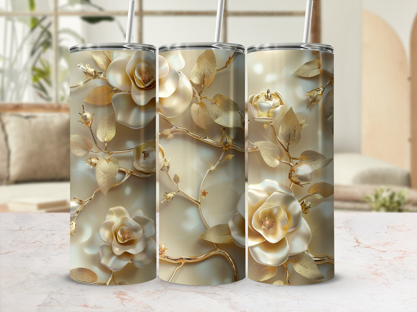 Three gold floral tumblers with elaborate rose and leaf designs.