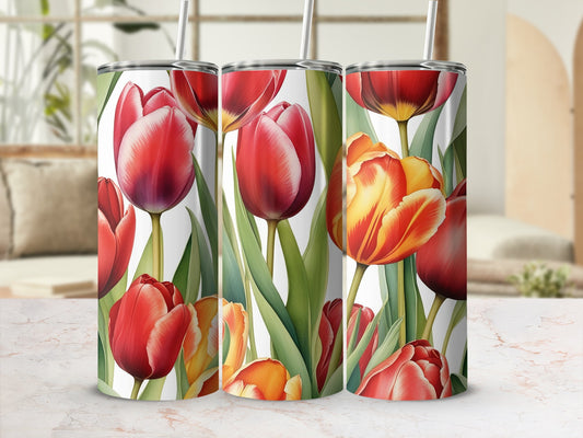 Three tumblers with a floral pattern of red and yellow tulips.